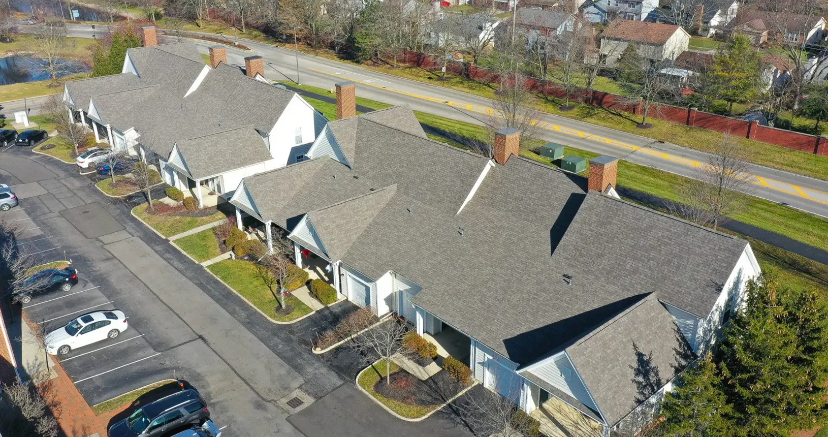 Multi-family units with new shingle commercial roofing on the Times Square Apartments in Dublin, Ohio.