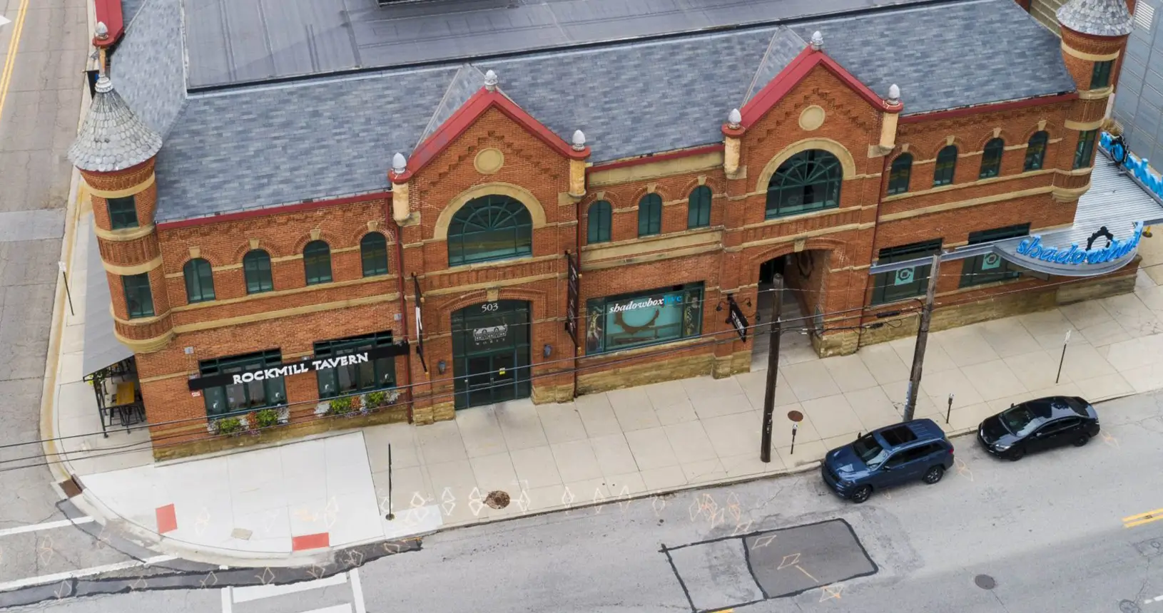 Front view of the updated Worly Building in Columbus with new rubber and shingle commercial roof.