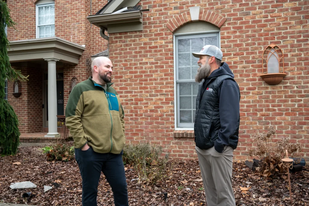 Granville homeowner with director of storm restoration Andrew Leachman from Able Roofing