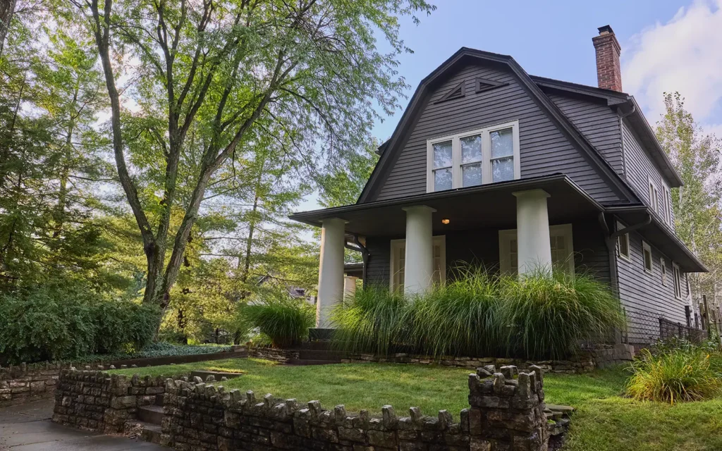 Whole home profile of a new roof replacement completed by Able Roofing featuring a hybrid asphalt and low slope roof.